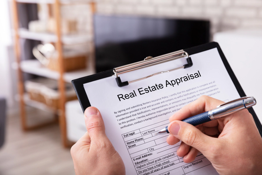 man writing real estate appraisal report